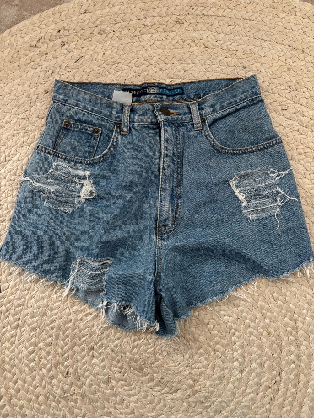 High-Rise Distressed Denim Shorts in Blue